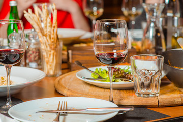 dinner in italian restaurant: salads, focaccio, wine