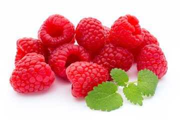 Ripe raspberry with leaf isolated on the white background.