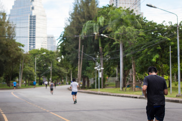 People jogging in Lumpini Park, Bangkok