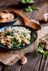 Fried chicken meat with spelt flour dumplings and spinach