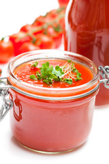 Glass  jar with tomato paste and cherry tomatoes isolated on whi