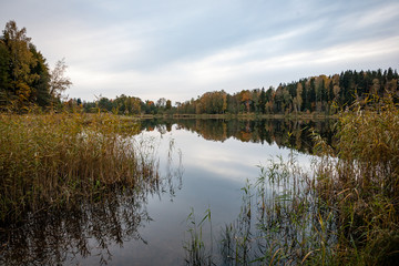 misty countryside landscape with lake in latvia