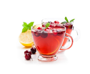Red  fruit tea with lemon and cranberry isolated on white backgr