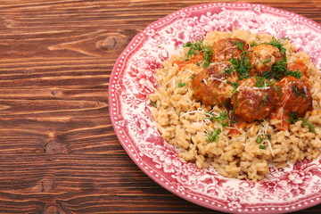 Meatballs in tomato sauce with rice in a bowl