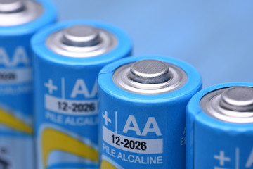 AA Batteries Closeup on a Blue Background