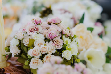pink roses in a gold vase