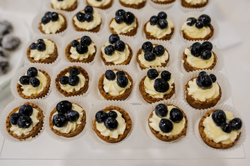 cakes basket with cream and grapes