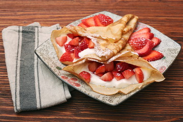 fresh crepes with strawberries and yogurt