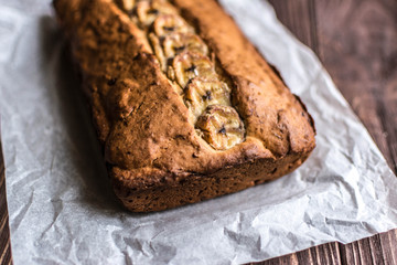 Homemade banana cake on a wooden background