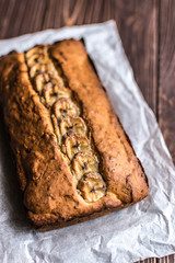 Homemade banana cake on a wooden background