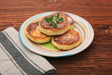 Cheese pancakes fried in a pan.