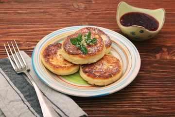 Cheese pancakes fried in a pan.