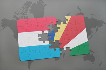 puzzle with the national flag of luxembourg and seychelles on a world map