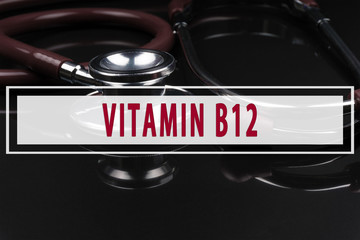 Obraz premium Stethoscope on black background with text VITAMIN B12