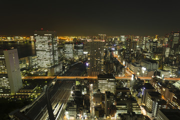東京都市風景　夜景　大都会の喧噪　様々な交通が交差　芝浦　田町　モノレール　新幹線　俯瞰