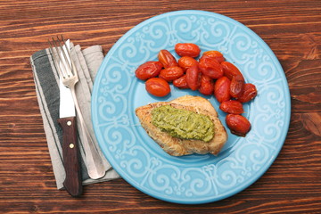tasty baked chicken breasts covered with basil pesto sauce