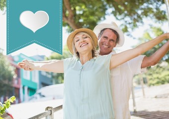 Obraz premium Mature couple standing with arms outstretched
