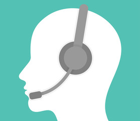 Online support and assistance or call center icon concept. Human head silhouette with a headset and microphone