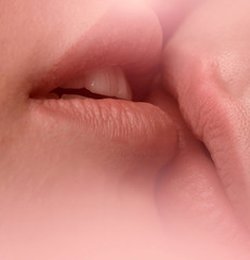 Homosexuality Tender kiss of two Lesbians. Closeup of pair women mouths kissing. Two girls with soft tender sexy mouths kissing closeup. Tender kisses of two lips of women