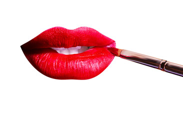 Lips with red lipstick, white teeth and brush for applying makeup. Perfect female sexy lips with...