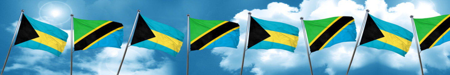 Bahamas flag with Tanzania flag, 3D rendering