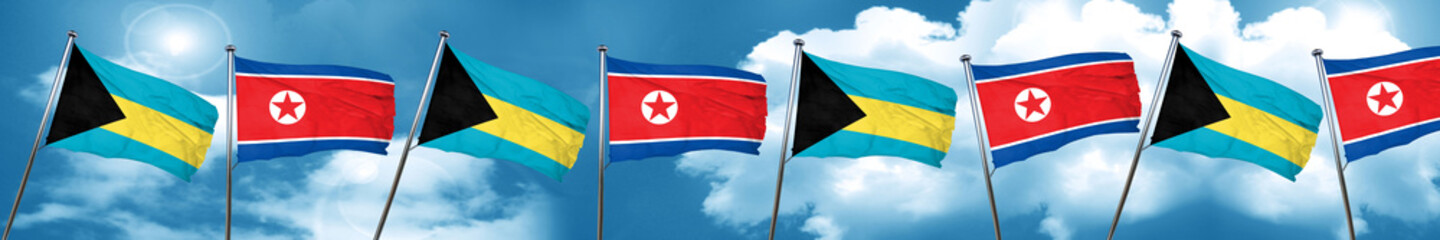 Bahamas flag with North Korea flag, 3D rendering