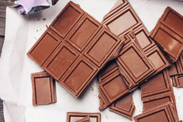 broken chocolate tile on a wooden background