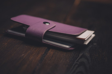 purple card holder with square sheets of paper