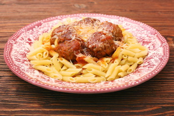 Meatballs with pasta on the plate