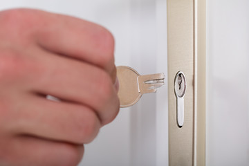 Person's Hand Holding Broken Key