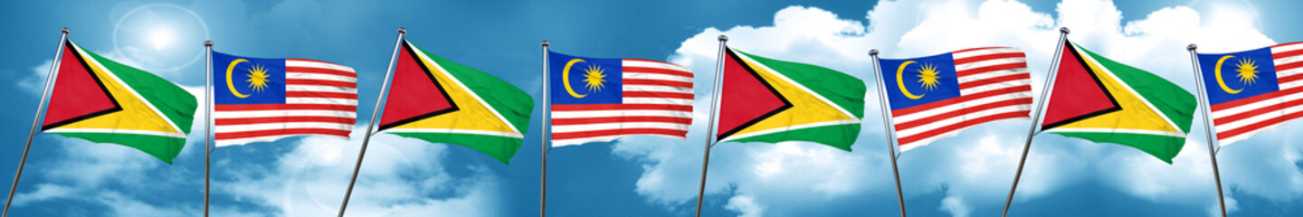 Guyana flag with Malaysia flag, 3D rendering