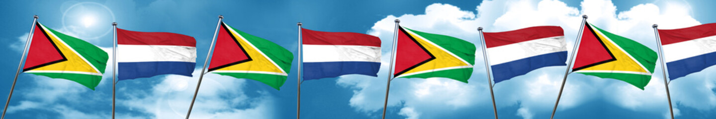 Guyana flag with Netherlands flag, 3D rendering