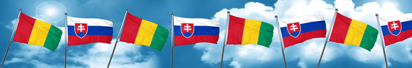 Guinea flag with Slovakia flag, 3D rendering