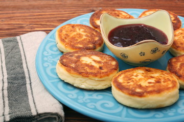 Cheese pancakes fried in a pan.