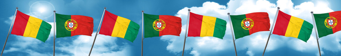 Guinea flag with Portugal flag, 3D rendering