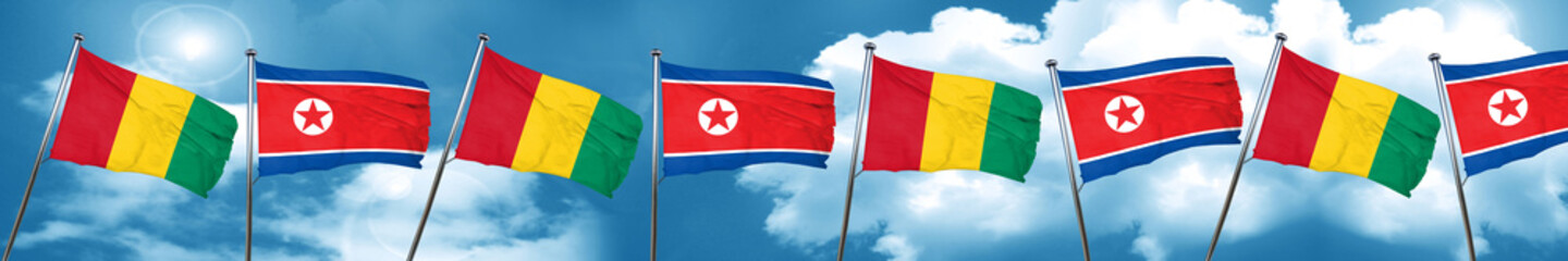 Guinea flag with North Korea flag, 3D rendering