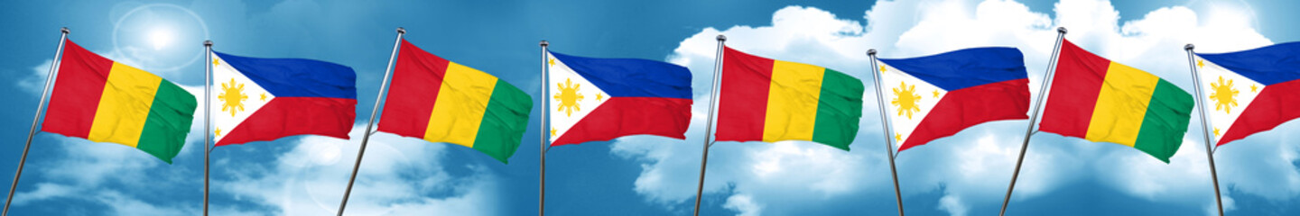 Guinea flag with Philippines flag, 3D rendering