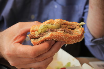 Man holding a hamburger