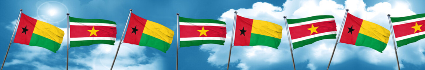 Obraz na płótnie Canvas Guinea bissau flag with Suriname flag, 3D rendering