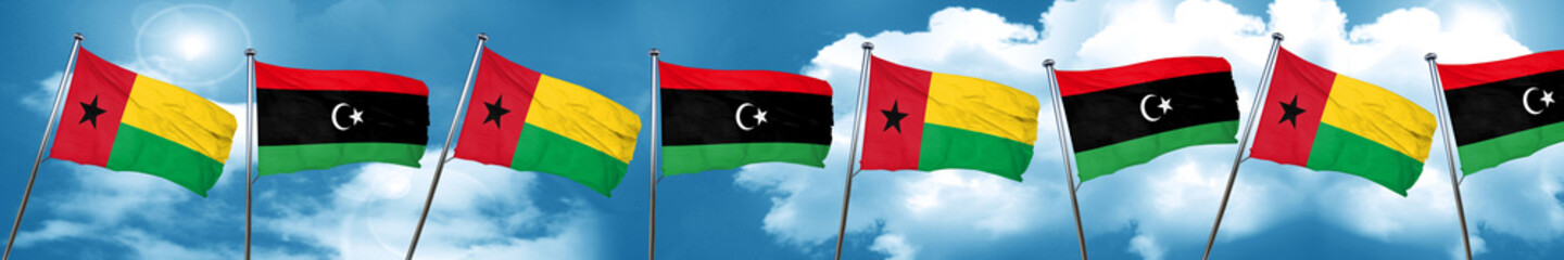Guinea bissau flag with Libya flag, 3D rendering
