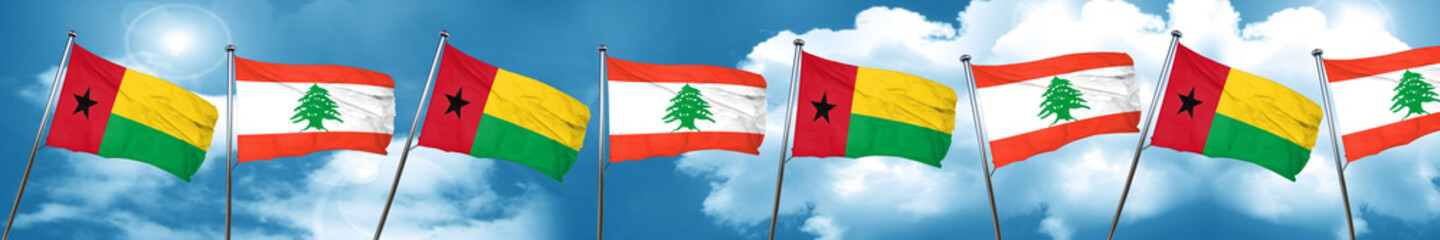 Guinea bissau flag with Lebanon flag, 3D rendering