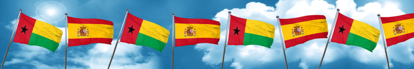 Guinea bissau flag with Spain flag, 3D rendering