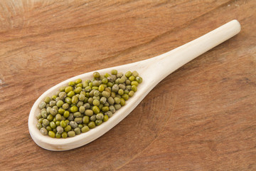 Mung bean on wood and isolated on white background
