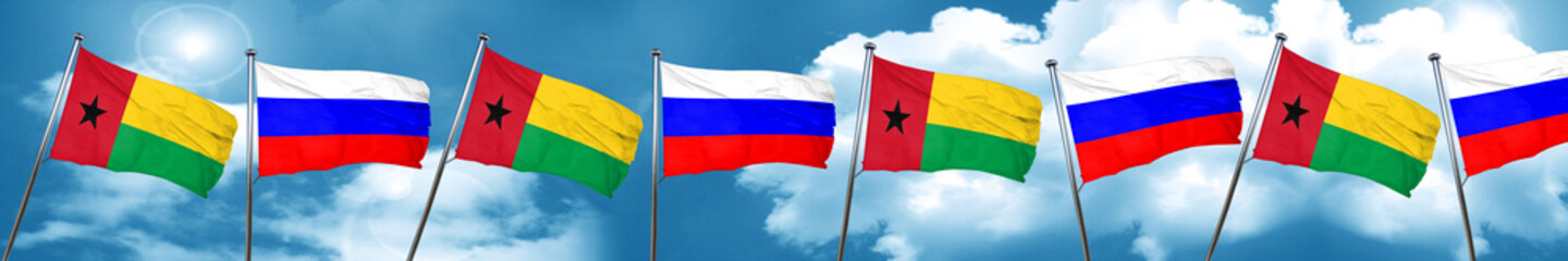 Fototapeta na wymiar Guinea bissau flag with Russia flag, 3D rendering
