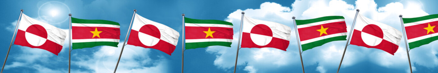 Fototapeta na wymiar greenland flag with Suriname flag, 3D rendering