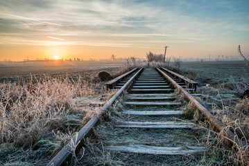 Sunrise at the forgotten railway during winter © Piotr Jankowiak