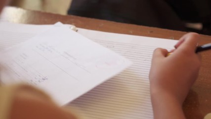 Young people and education. Group of hispanic students in class at school during lesson. Good grade for smart student on test