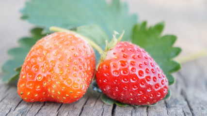 Fresh strawberries on old wooden background