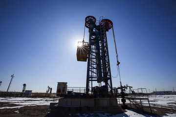 Oil field scene,Tower type pumping unit under the blue sky