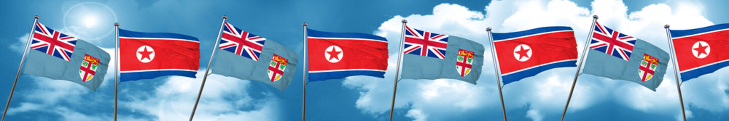 Fiji flag with North Korea flag, 3D rendering